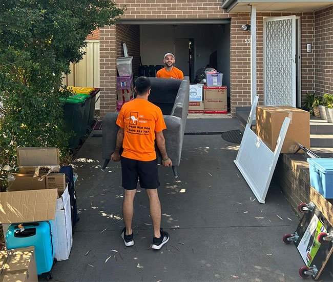 Professional furniture removalist in Sydney loading items into moving truck